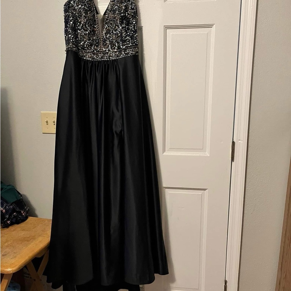 Navy and silver. Only worn once. Alterations done but can be taken out